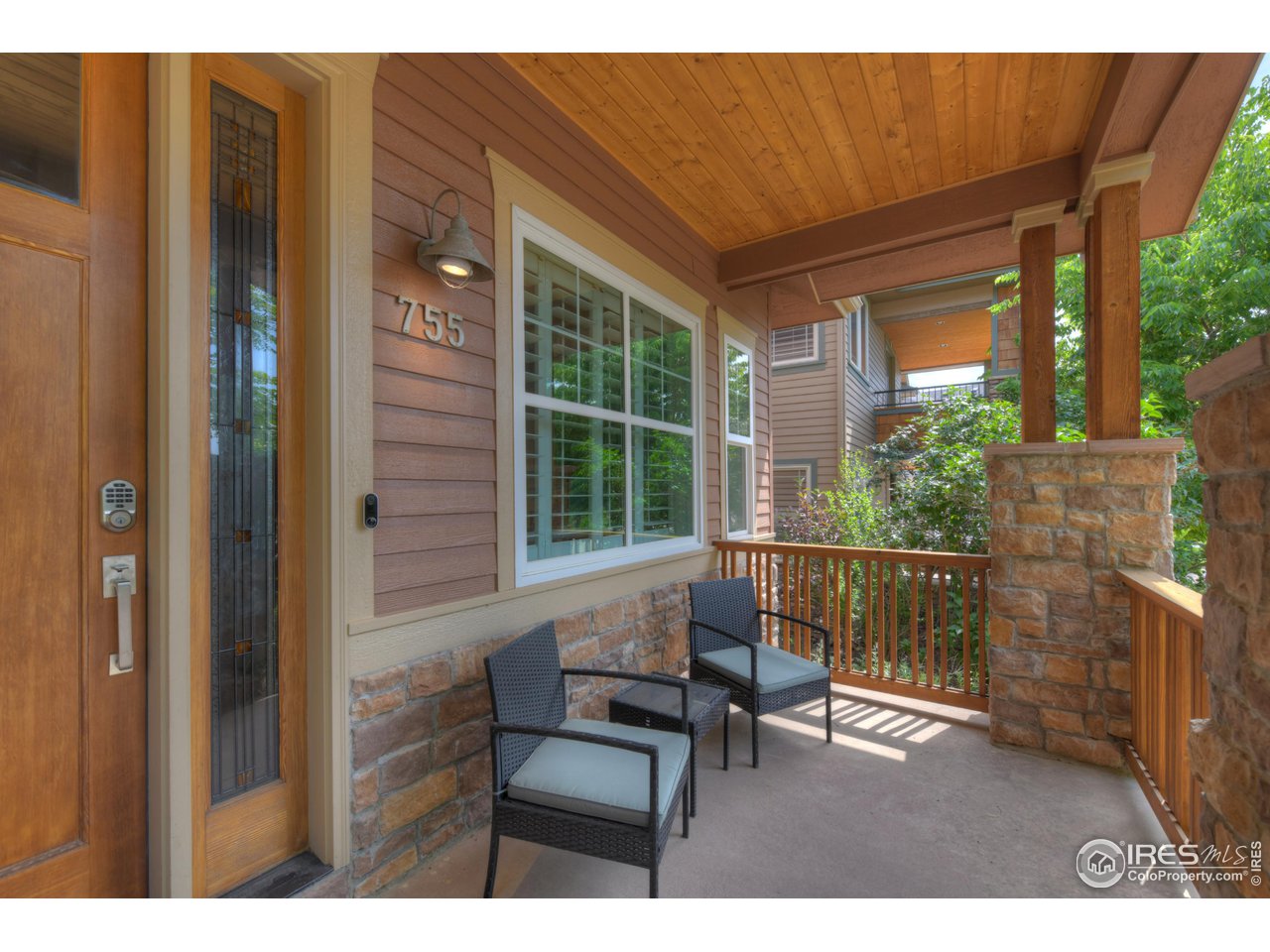 755 Terrace Circle South Boulder, CO 80304 - Photo 4 of 38 a balcony with chairs and a table