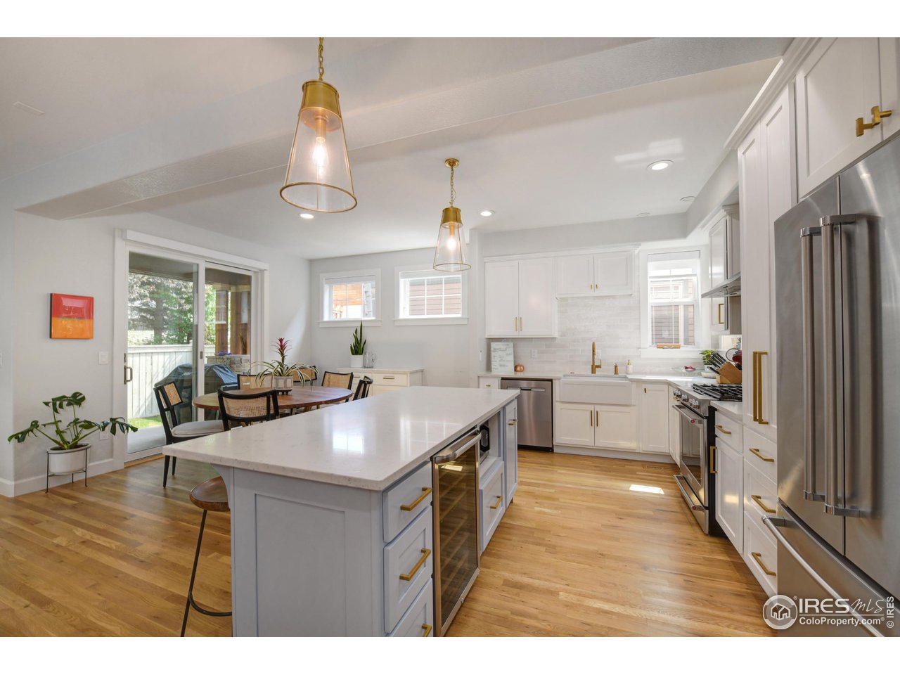 755 Terrace Circle South Boulder, CO 80304 - Photo 7 of 38 a kitchen with stainless steel appliances granite countertop a sink stove and refrigerator