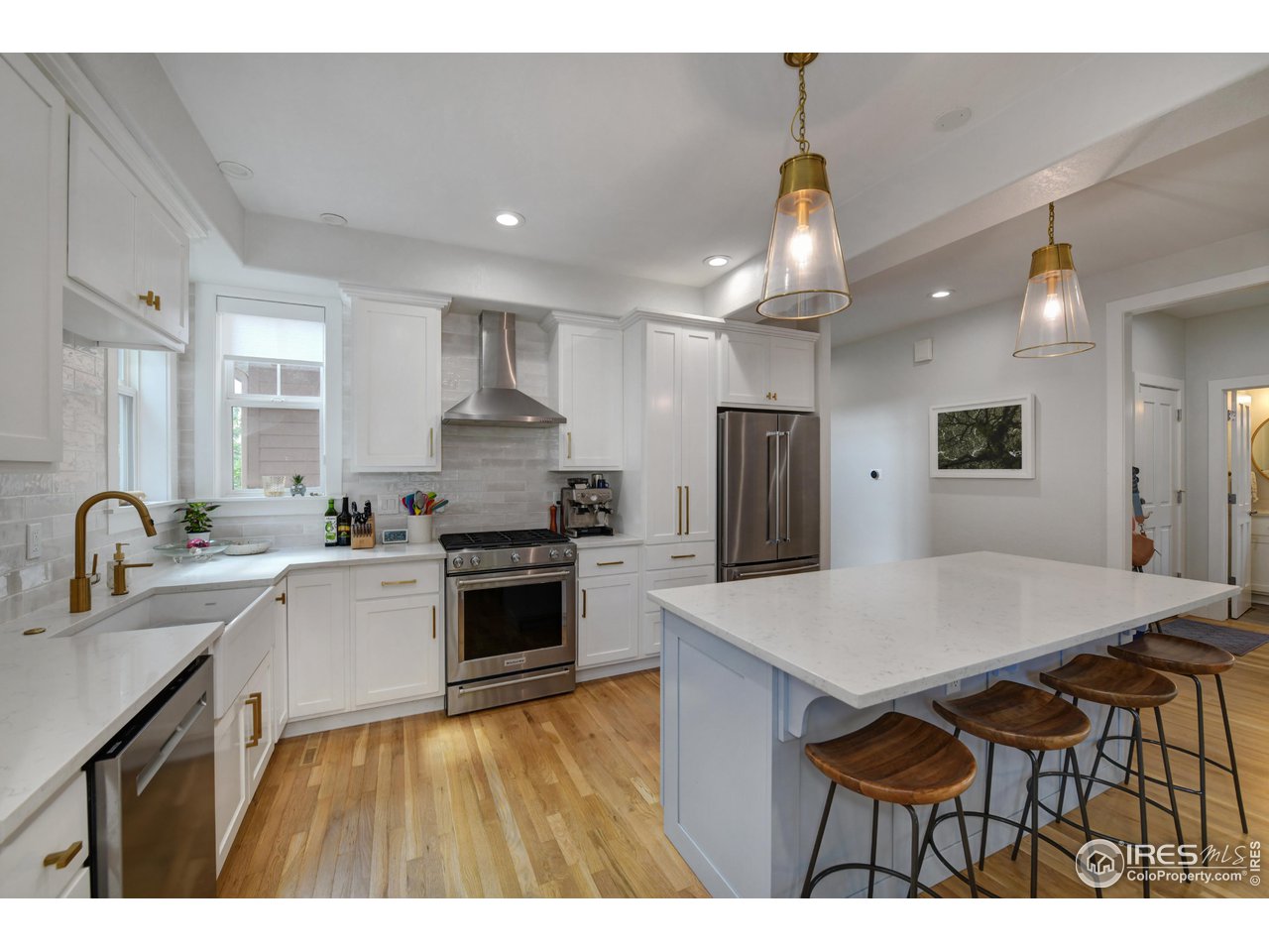 755 Terrace Circle South Boulder, CO 80304 - Photo 10 of 38 a kitchen with kitchen island a sink stove and refrigerator