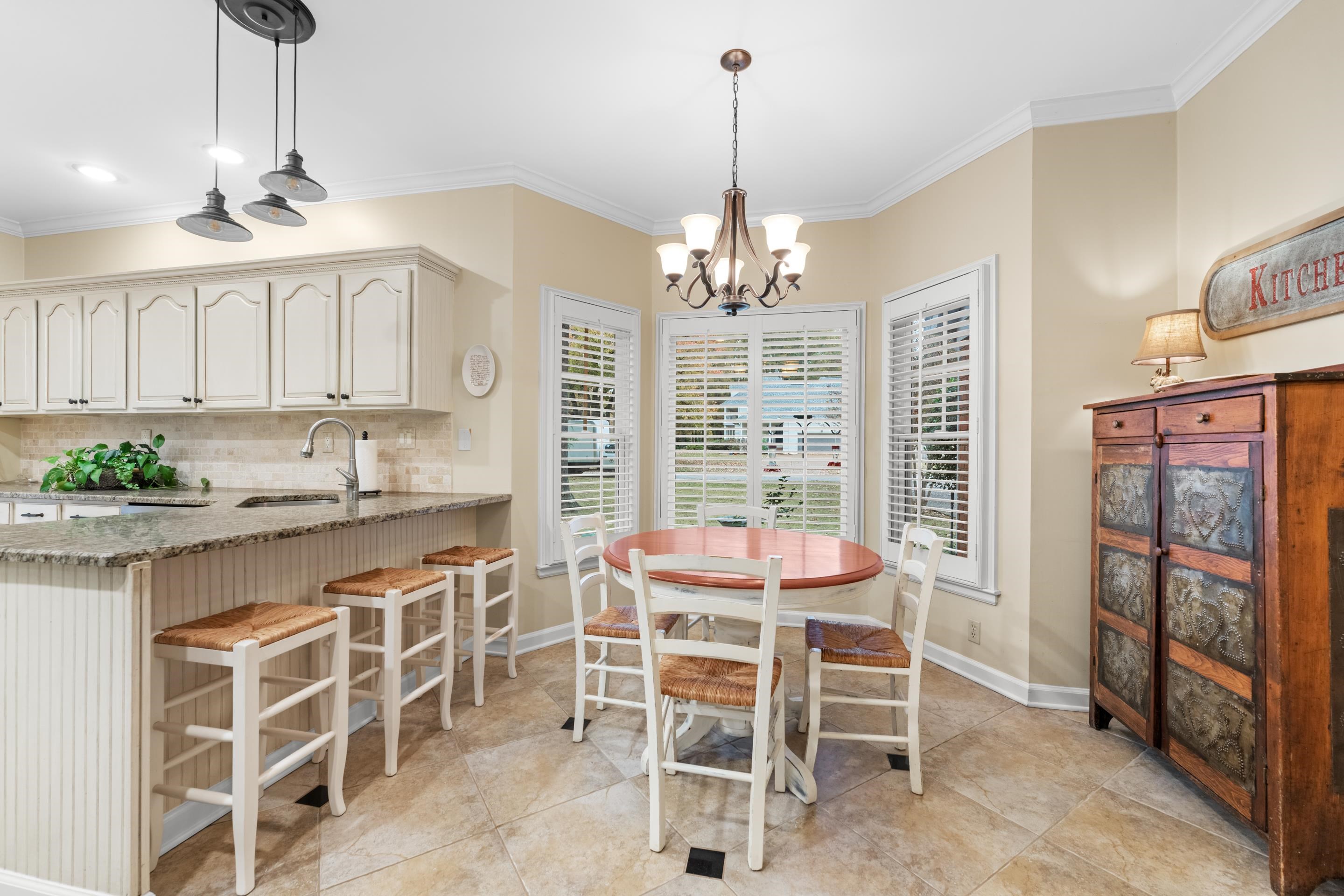 3430 Shea Road Collierville, TN 38017 - Photo 14 of 40 a large kitchen with a table and chairs