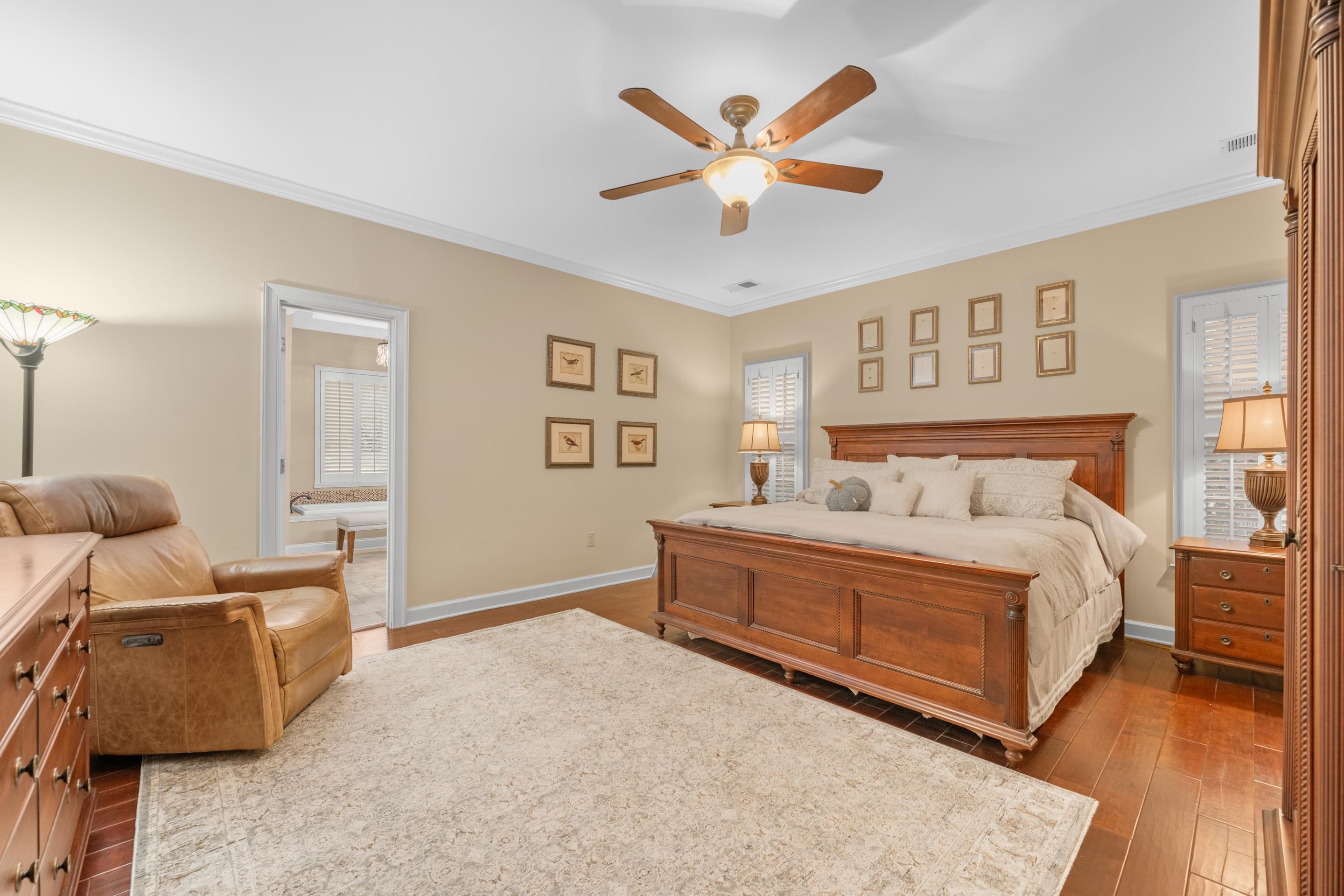 3430 Shea Road Collierville, TN 38017 - Photo 18 of 40 a bedroom with a bed and a chandelier