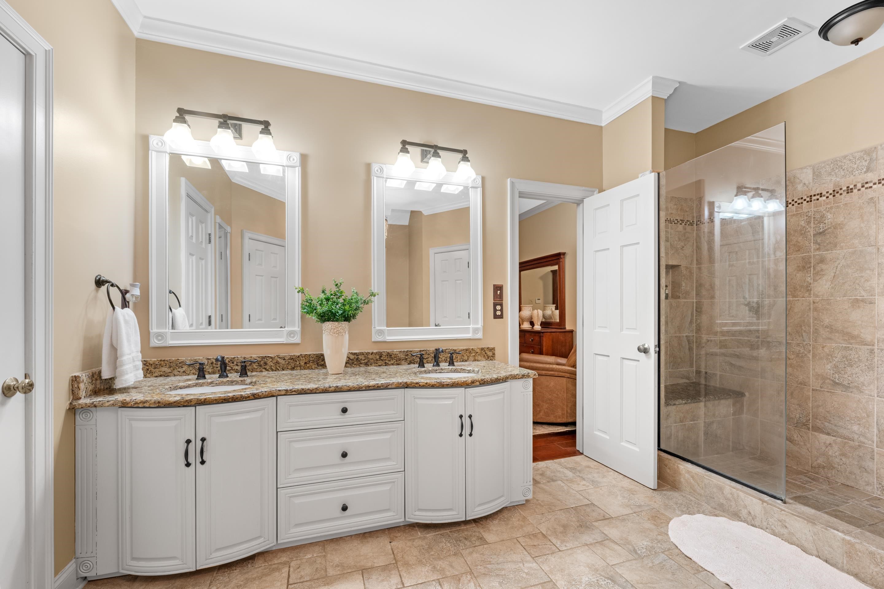3430 Shea Road Collierville, TN 38017 - Photo 19 of 40 a bathroom with a double vanity sink and a mirror