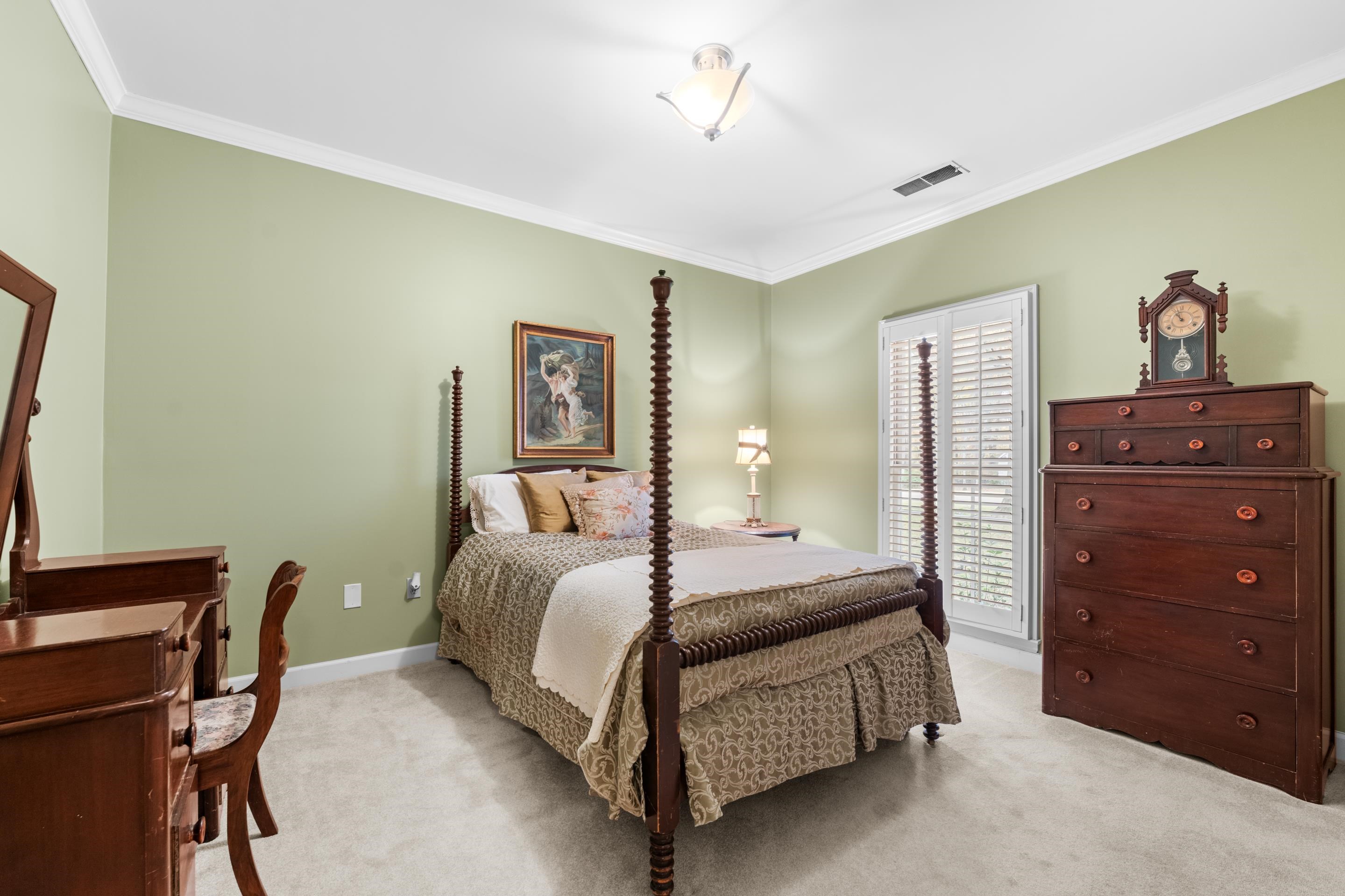 3430 Shea Road Collierville, TN 38017 - Photo 23 of 40 a bedroom with a bed and a dresser
