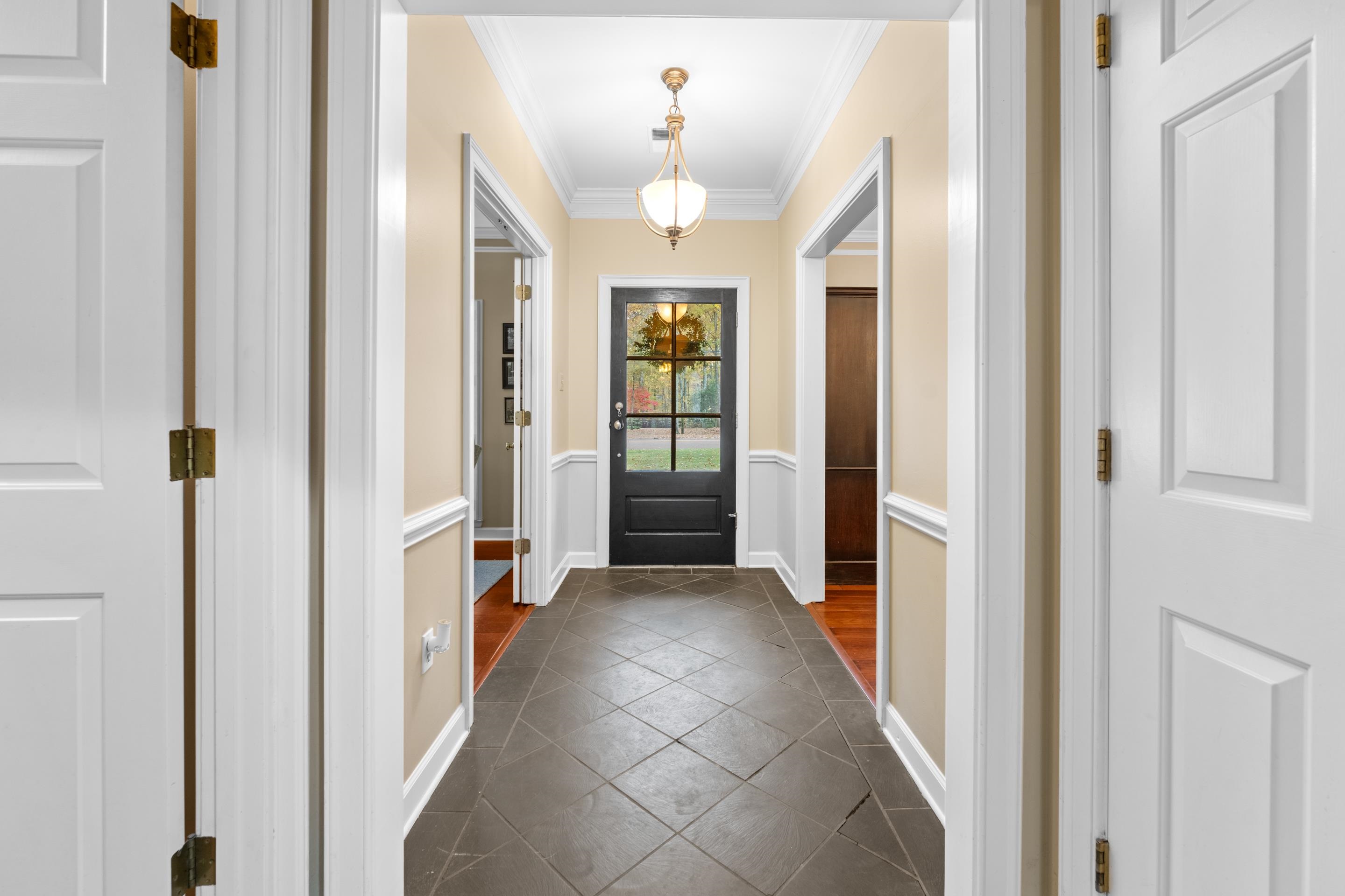 3430 Shea Road Collierville, TN 38017 - Photo 3 of 40 a view of a hallway with wooden shelves