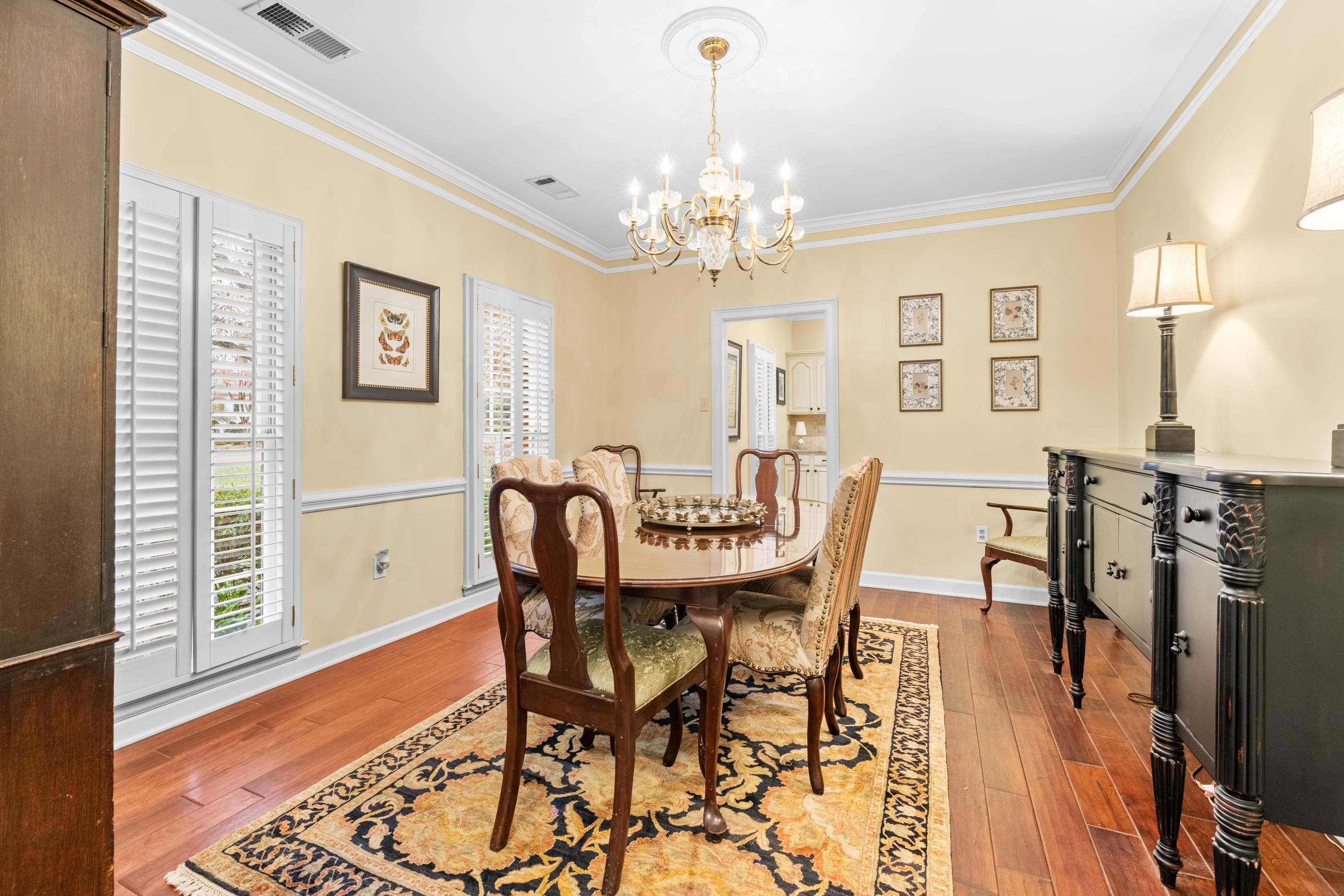 3430 Shea Road Collierville, TN 38017 - Photo 4 of 40 a view of a dining room with furniture and chandelier