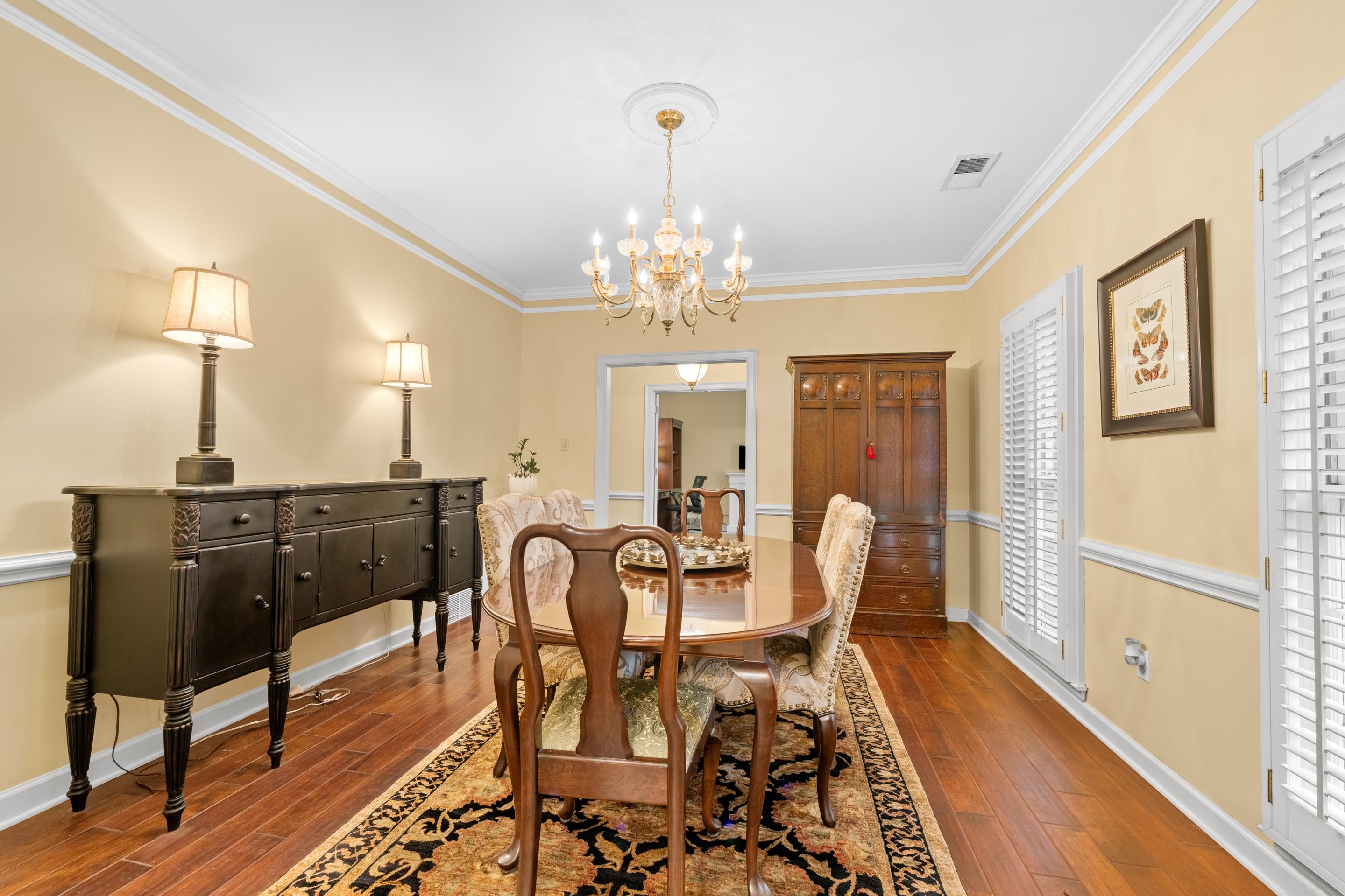 3430 Shea Road Collierville, TN 38017 - Photo 5 of 40 a view of a dining room with furniture and wooden floor