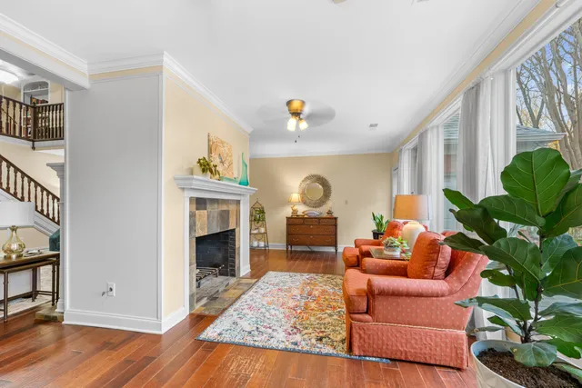a living room with furniture and a fireplace