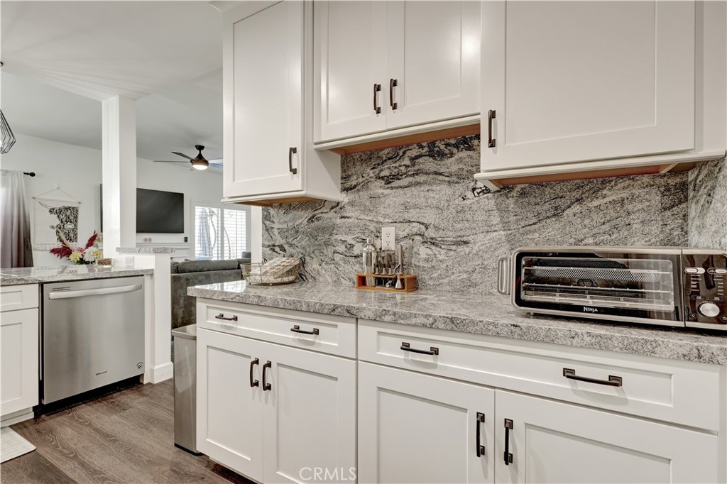 28102 Bobwhite Circle, Unit 3 Saugus, CA 91350 - Photo 16 of 50 a kitchen with stainless steel appliances white cabinets and a sink