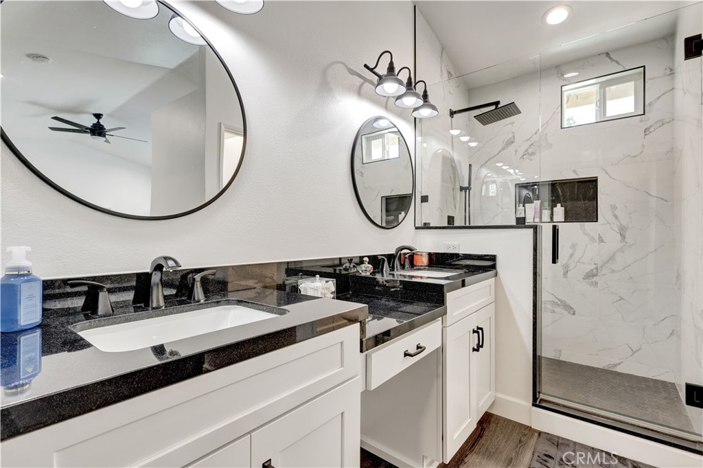 28102 Bobwhite Circle, Unit 3 Saugus, CA 91350 - Photo 32 of 50 a bathroom with a sink and a mirror