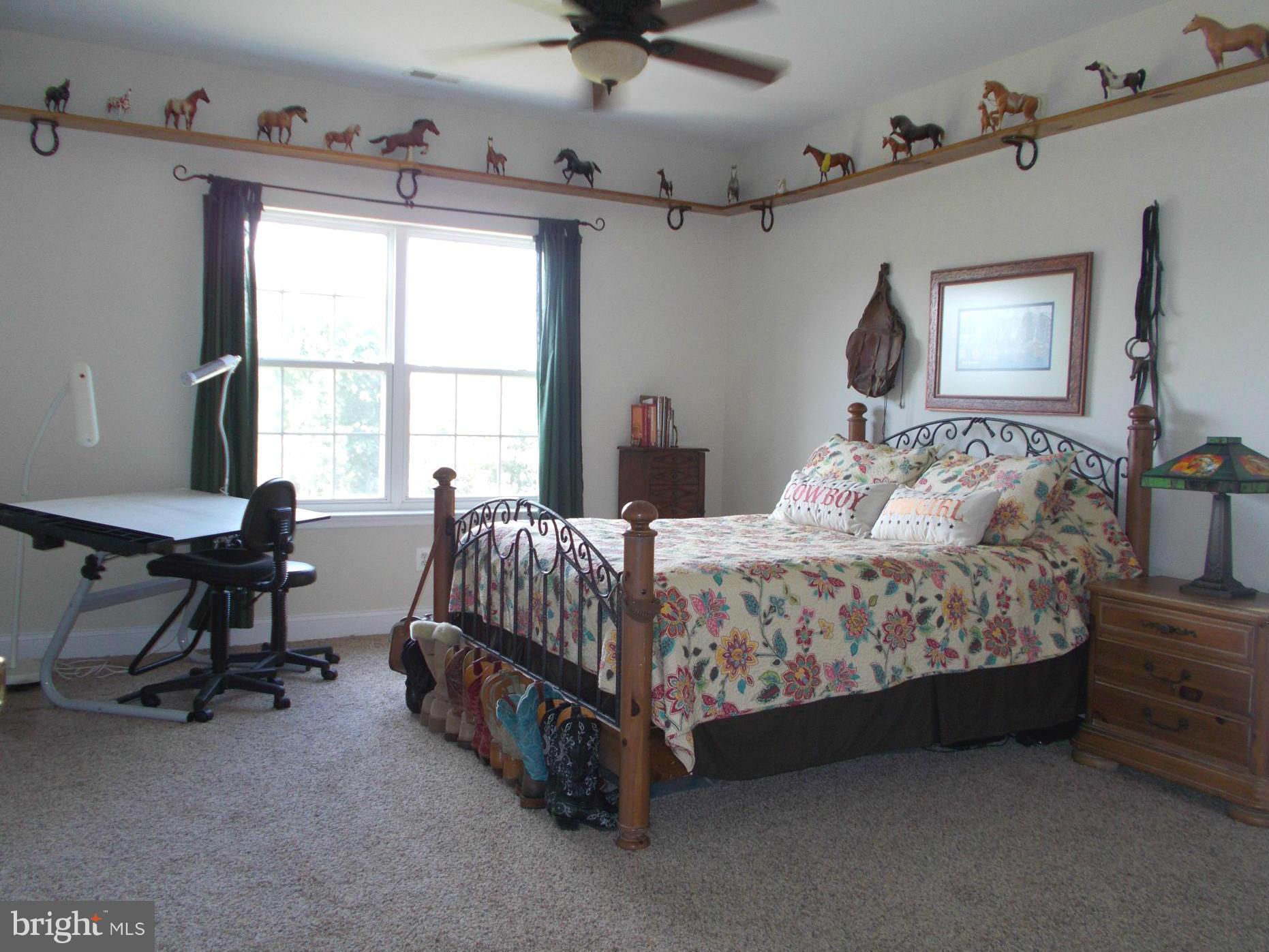 7475 Flint Hill Road Owings, MD 20736 - Photo 16 of 30 a bedroom with a bed chair and window