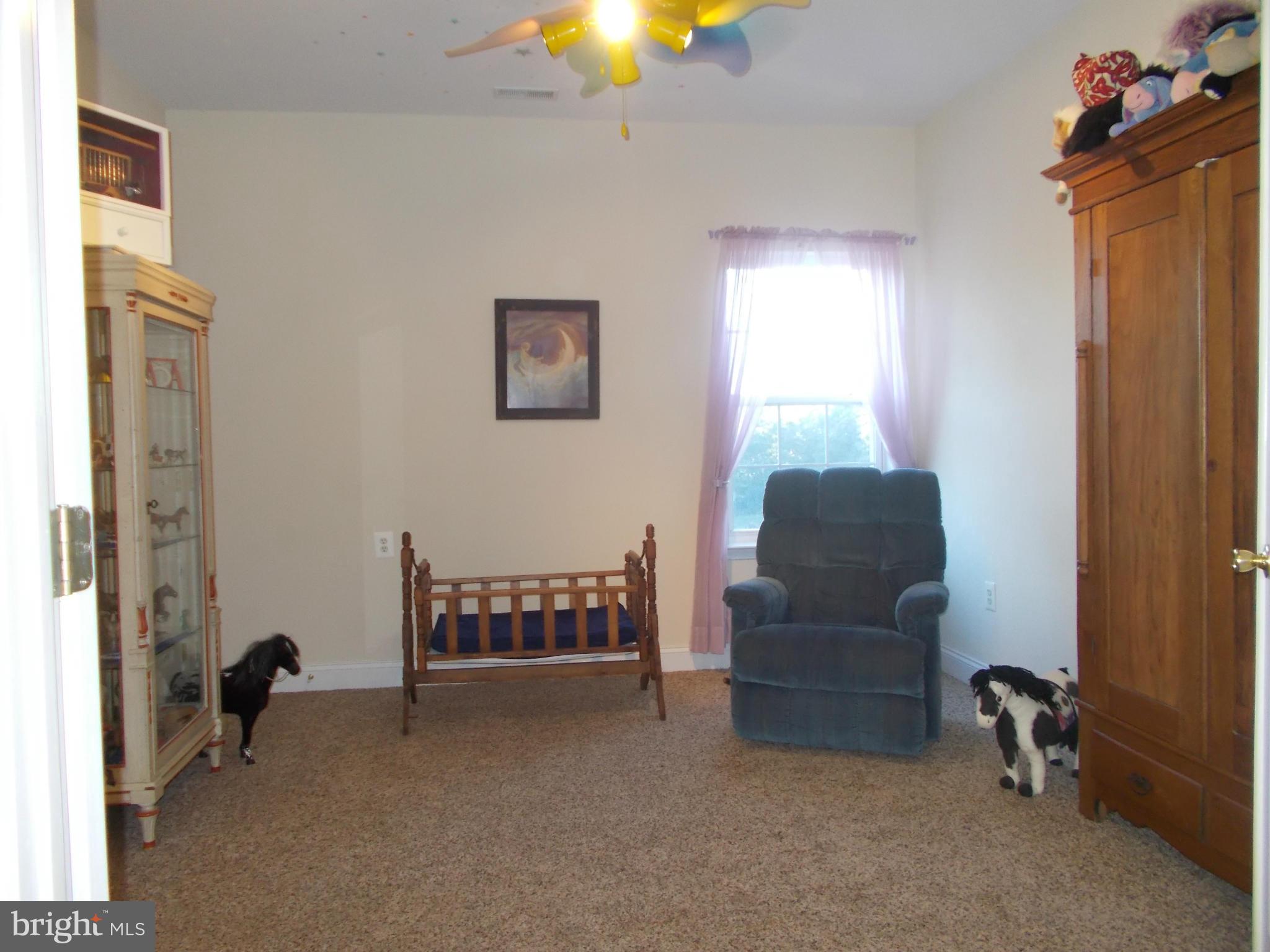 7475 Flint Hill Road Owings, MD 20736 - Photo 18 of 30 a living room with furniture and a window