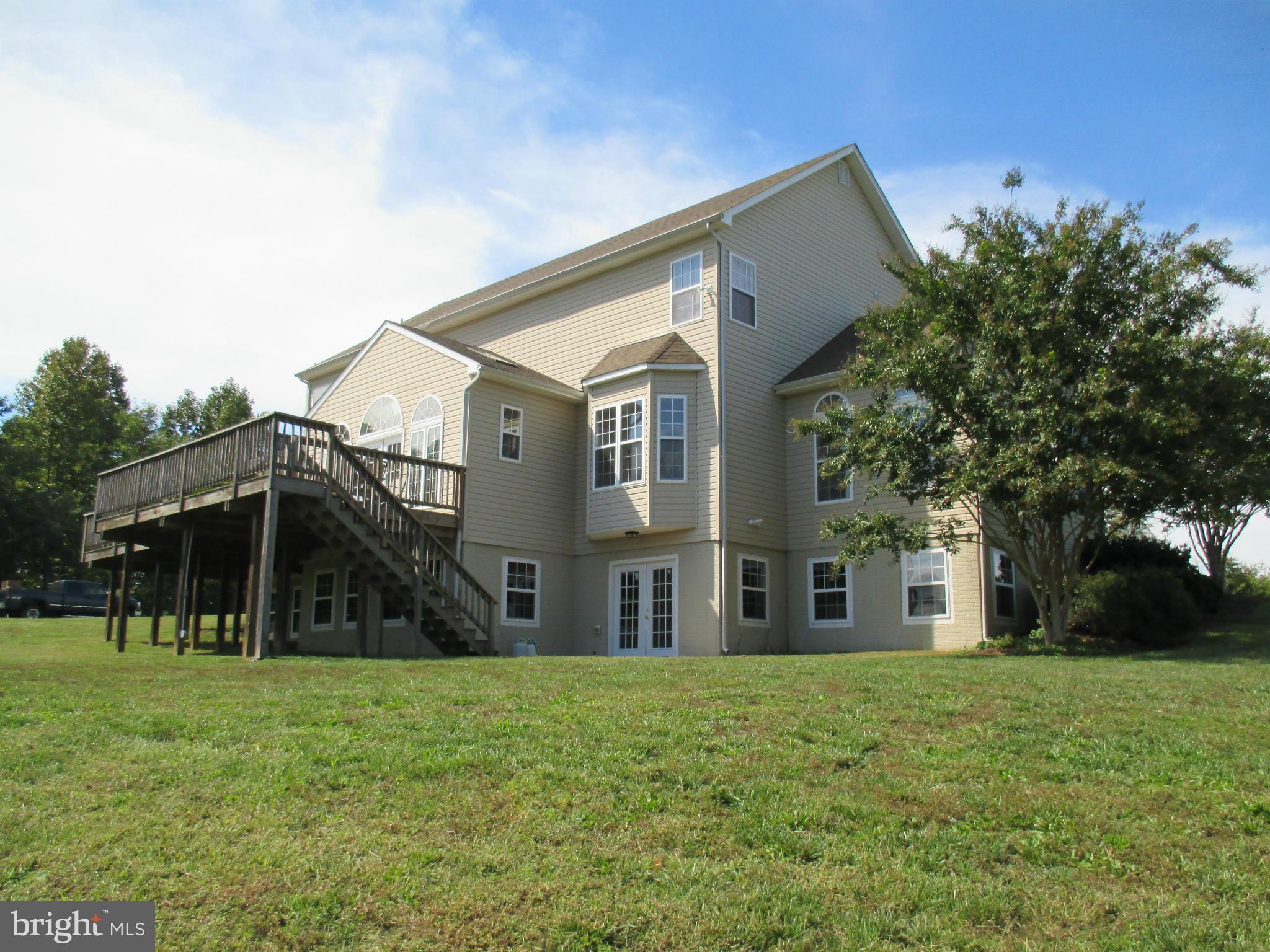 7475 Flint Hill Road Owings, MD 20736 - Photo 20 of 30 a view of a house with backyard and a tree