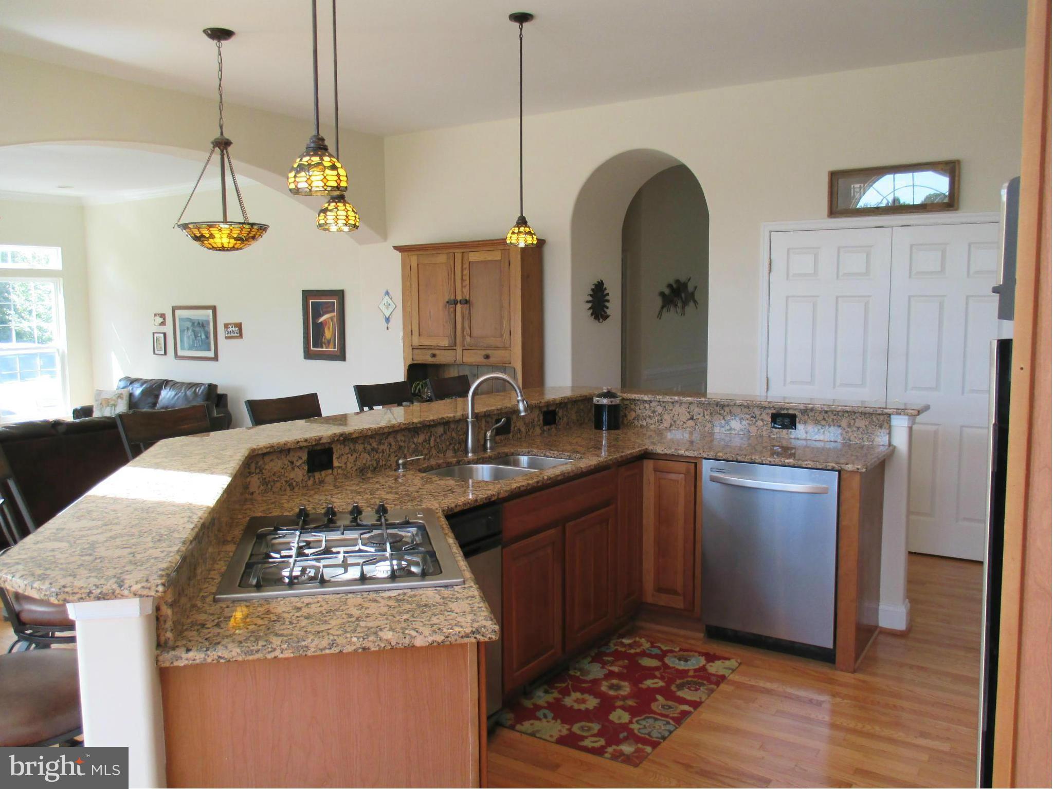7475 Flint Hill Road Owings, MD 20736 - Photo 7 of 30 a kitchen with a stove and a sink