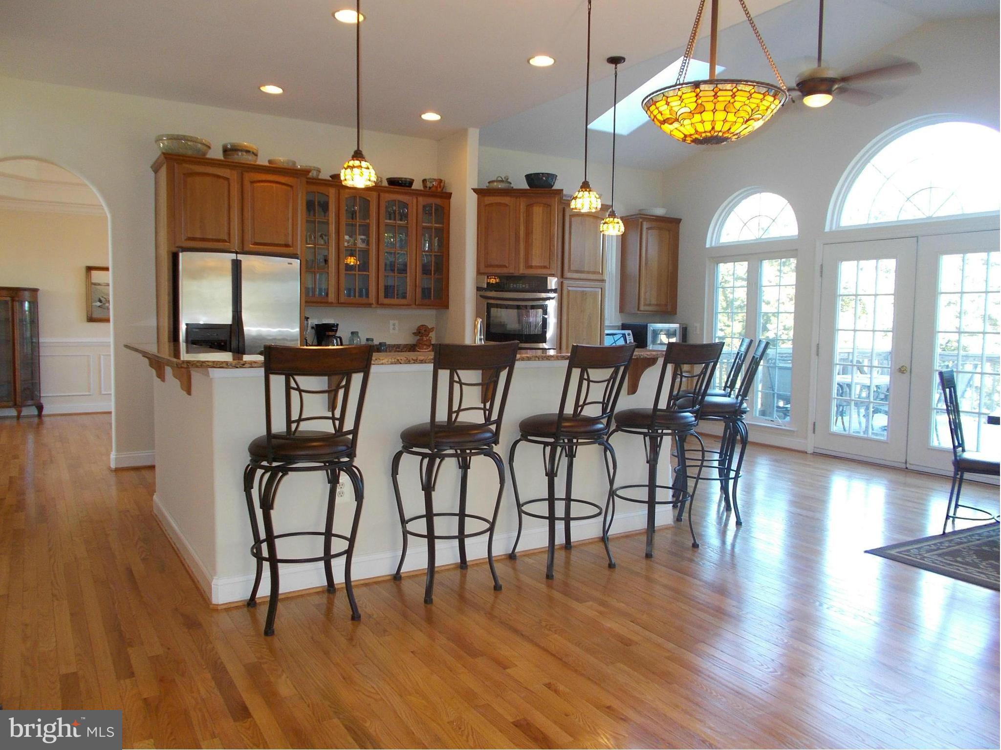 7475 Flint Hill Road Owings, MD 20736 - Photo 9 of 30 a view of a dining room with furniture window and wooden floor