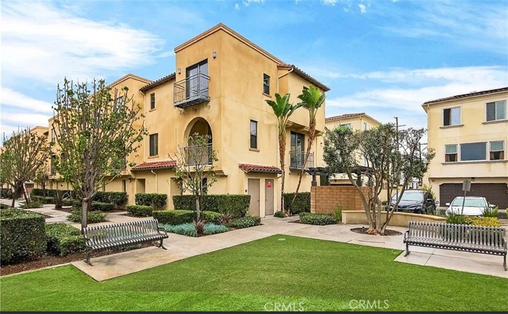 809 Anaheim Boulevard, Unit 106 Anaheim, CA 92805 - Photo 2 of 9 a front view of a house with a yard