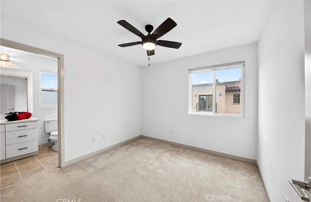 809 Anaheim Boulevard, Unit 106 Anaheim, CA 92805 - Photo 8 of 9 an empty room with cabinet and ceiling fan