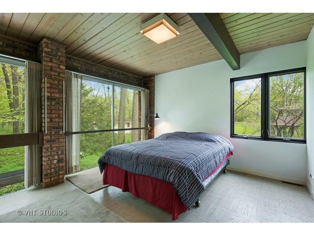 3290 Brook Road Highland Park, IL 60035 - Photo 12 of 19 a bedroom with a large bed and a large window