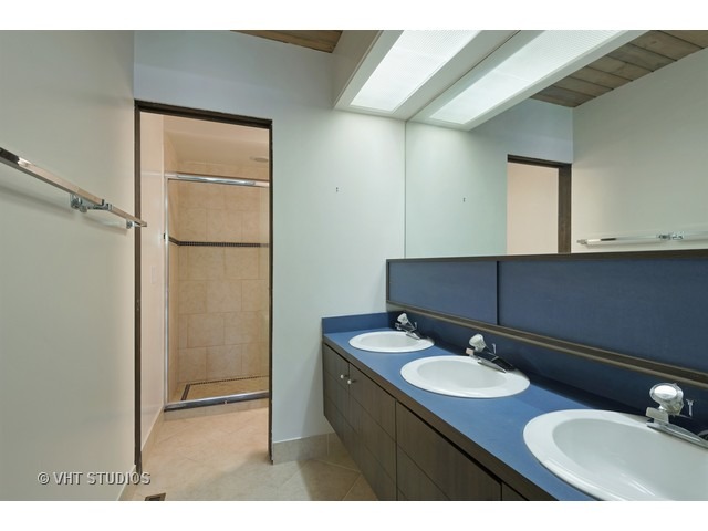 3290 Brook Road Highland Park, IL 60035 - Photo 13 of 19 a bathroom with a sink and a mirror