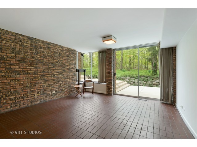 3290 Brook Road Highland Park, IL 60035 - Photo 9 of 19 a view of an empty room with wooden floor and a window