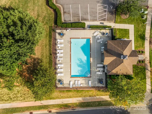 a view of swimming pool with outdoor seating