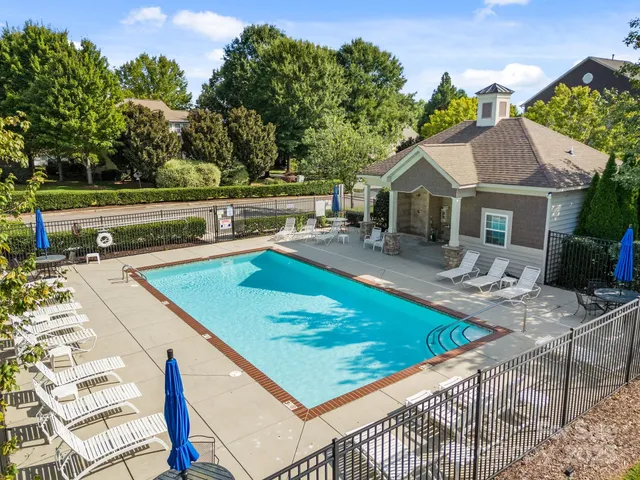 a view of a house with swimming pool