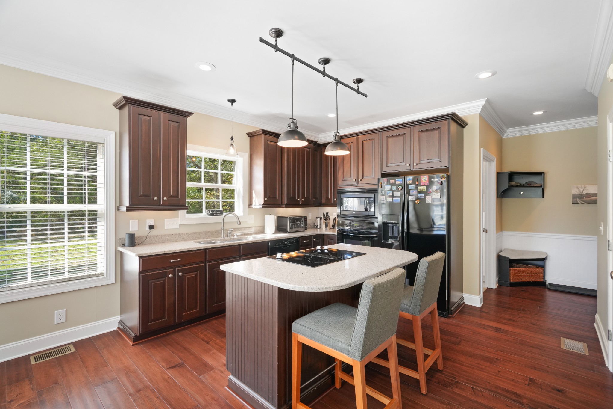 1124 Friendswood Lane Christiana, TN 37037 - Photo 16 of 34 a kitchen that has a table chairs in it and wooden floors