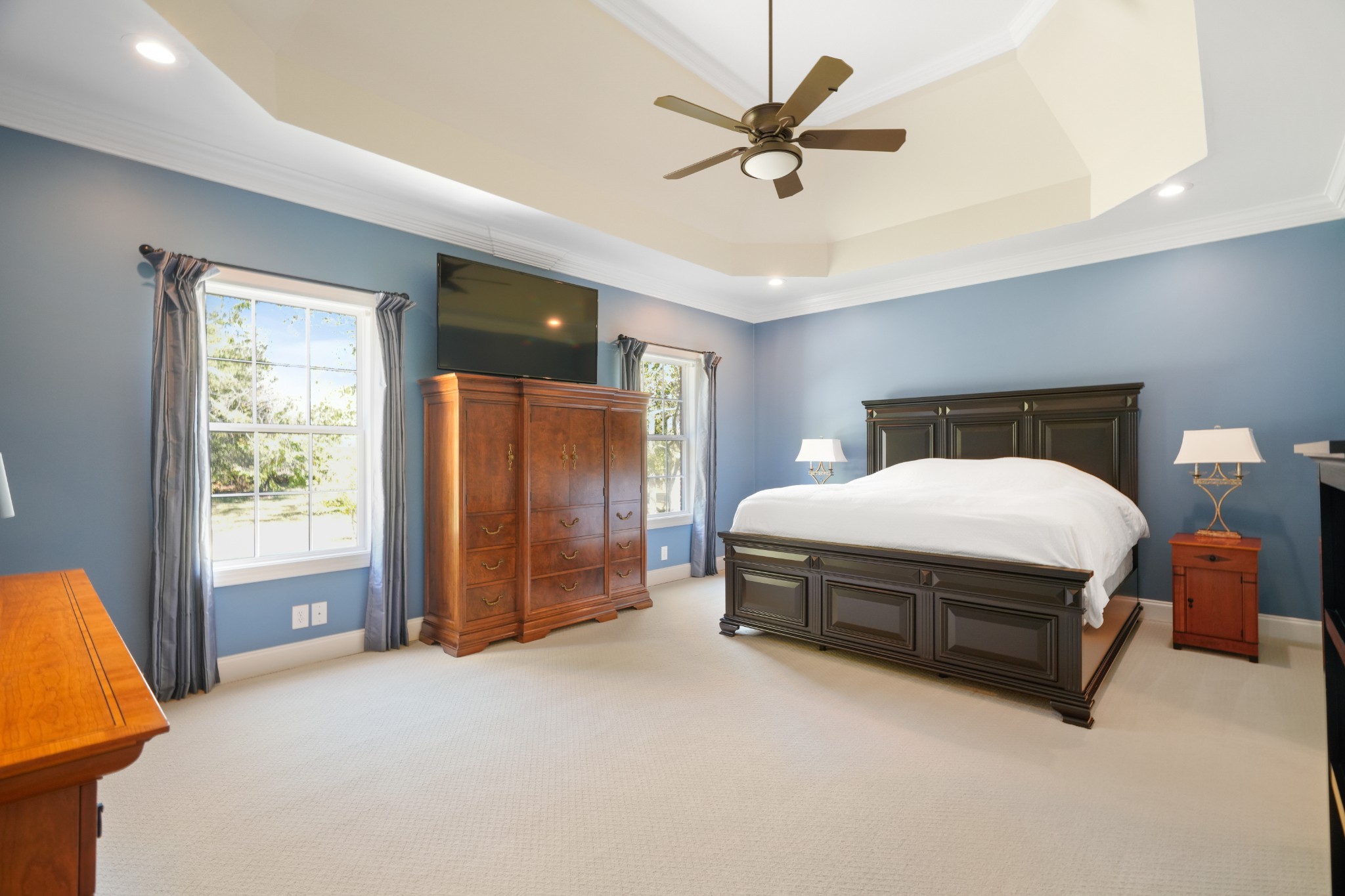1124 Friendswood Lane Christiana, TN 37037 - Photo 19 of 34 a spacious bedroom with a bed and a chandelier