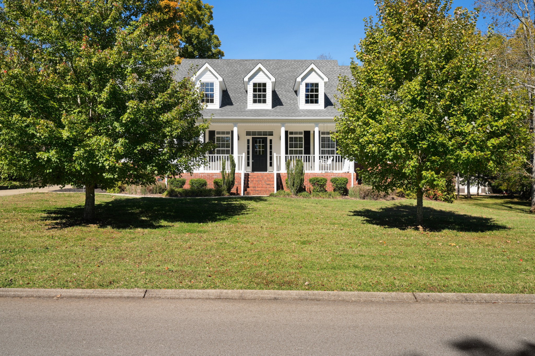 1124 Friendswood Lane Christiana, TN 37037 - Photo 2 of 34 a front view of a house with garden