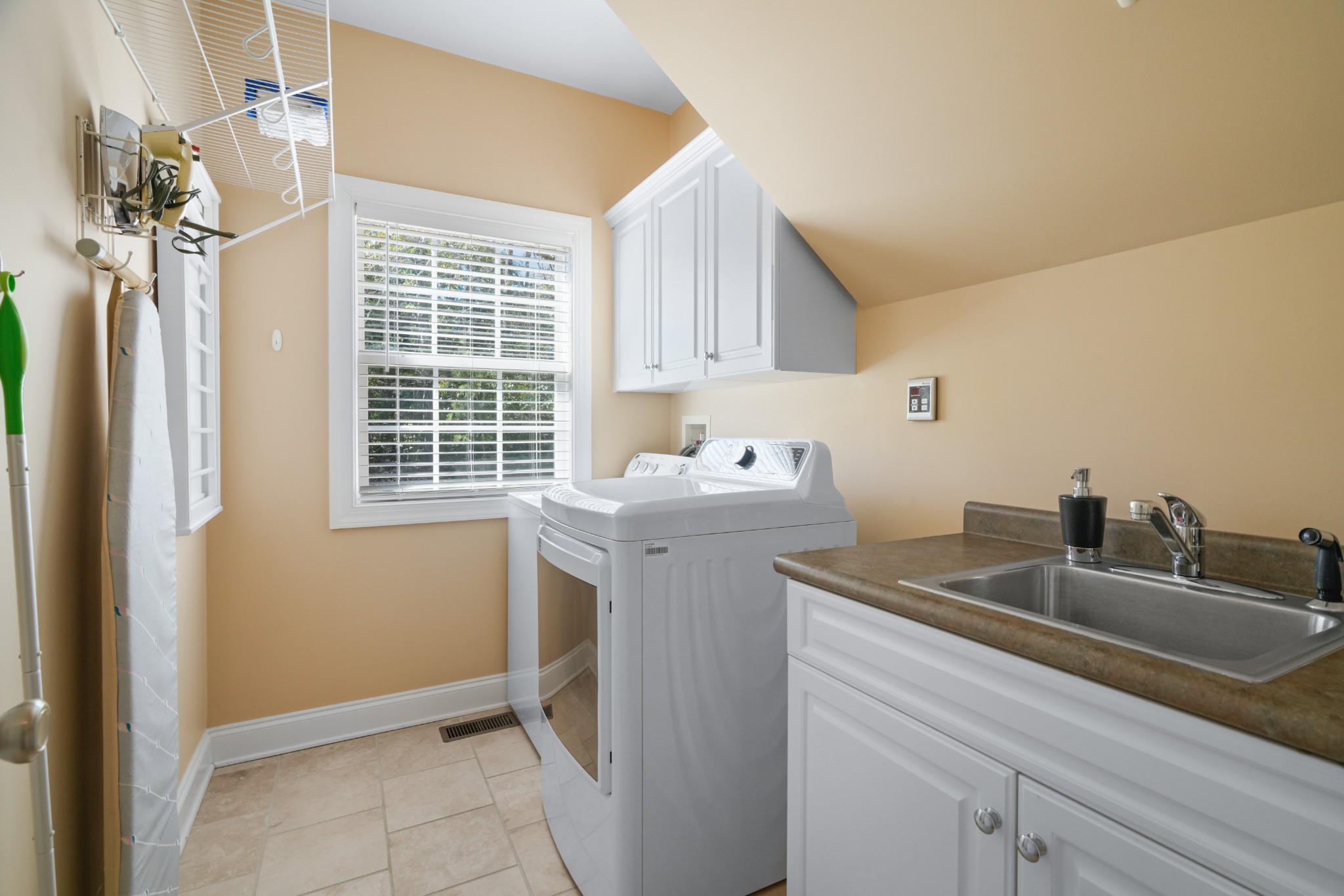 1124 Friendswood Lane Christiana, TN 37037 - Photo 34 of 34 a utility room with faucet washer and dryer