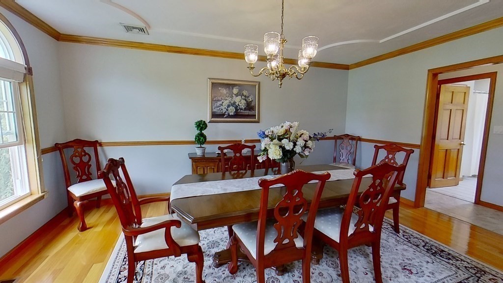 35 Brownfield Drive Bridgewater, MA 02324 - Photo 15 of 42 a view of a dining room with furniture and chandelier