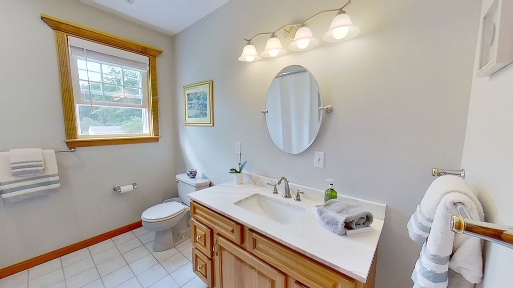 35 Brownfield Drive Bridgewater, MA 02324 - Photo 16 of 42 a bathroom with a sink vanity granite and a mirror