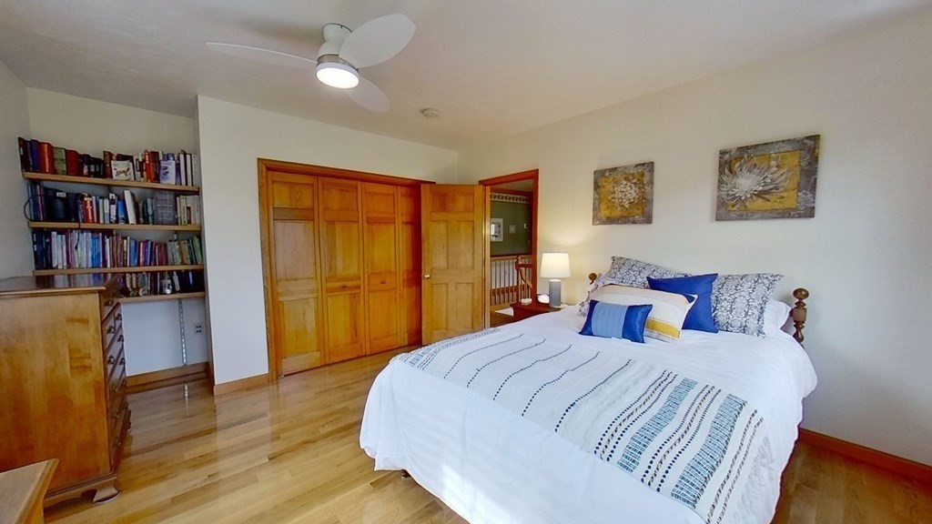 35 Brownfield Drive Bridgewater, MA 02324 - Photo 19 of 42 a bedroom with a bed and a book shelf