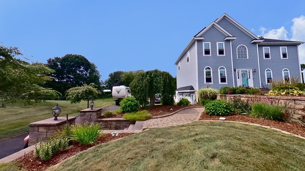 35 Brownfield Drive Bridgewater, MA 02324 - Photo 2 of 42 a front view of a house with a yard