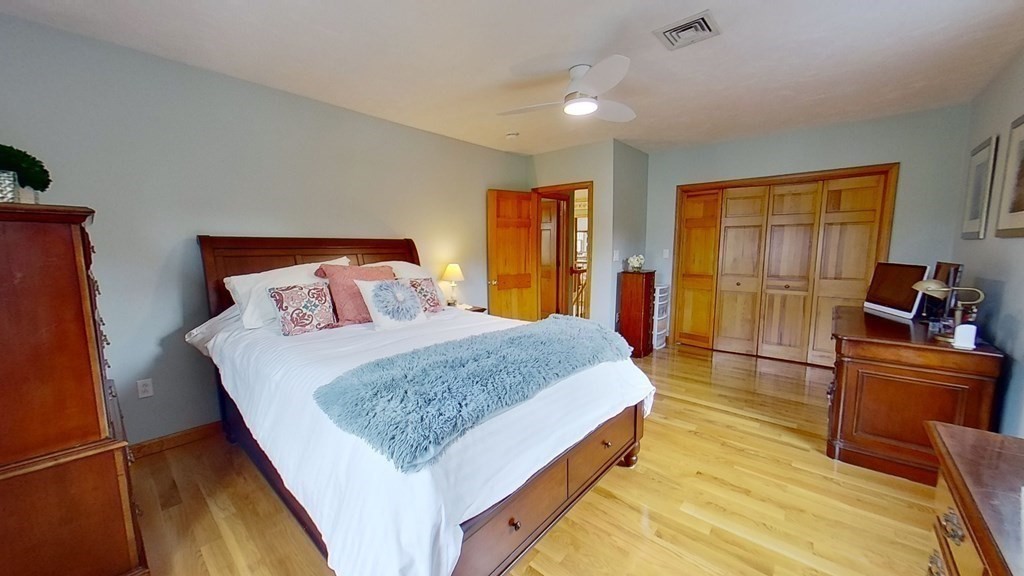 35 Brownfield Drive Bridgewater, MA 02324 - Photo 24 of 42 a bedroom with a bed and wooden floor