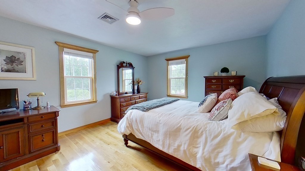 35 Brownfield Drive Bridgewater, MA 02324 - Photo 26 of 42 a bedroom with a bed and wooden floor