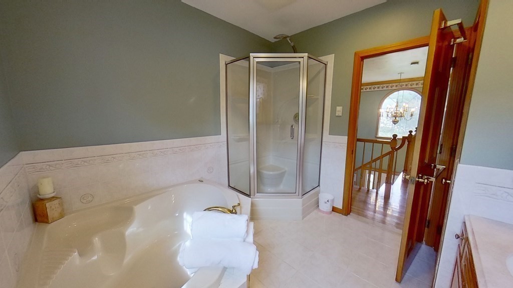 35 Brownfield Drive Bridgewater, MA 02324 - Photo 28 of 42 a bathroom with a tub and shower