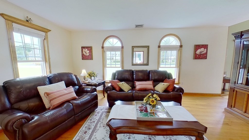 35 Brownfield Drive Bridgewater, MA 02324 - Photo 8 of 42 a living room with furniture fireplace and a window