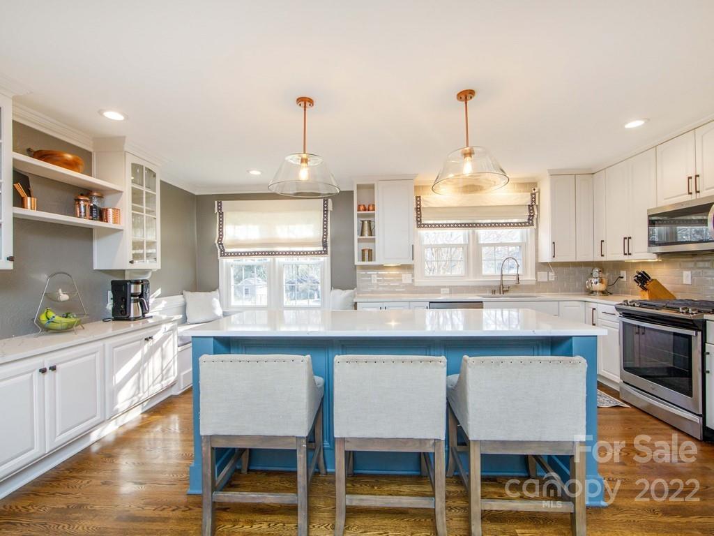 1000 Braeburn Road Charlotte, NC 28211 - Photo 15 of 48 a kitchen with kitchen island granite countertop a sink and counter space