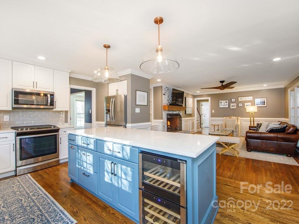 1000 Braeburn Road Charlotte, NC 28211 - Photo 19 of 48 a large kitchen with stainless steel appliances granite countertop a stove and a center island