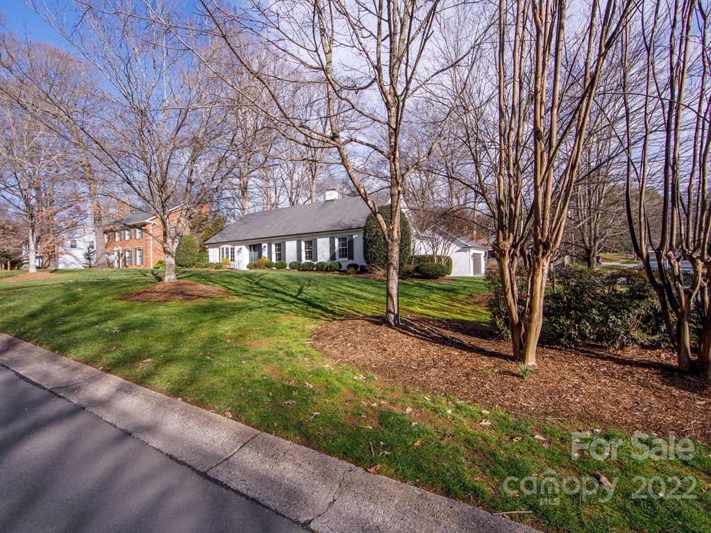 1000 Braeburn Road Charlotte, NC 28211 - Photo 2 of 48 a view of a yard with plants and trees