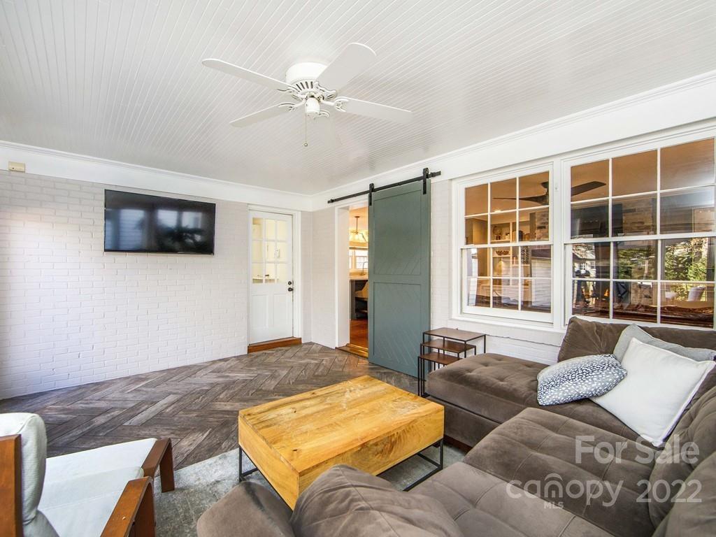 1000 Braeburn Road Charlotte, NC 28211 - Photo 25 of 48 a bedroom with furniture and a flat screen tv