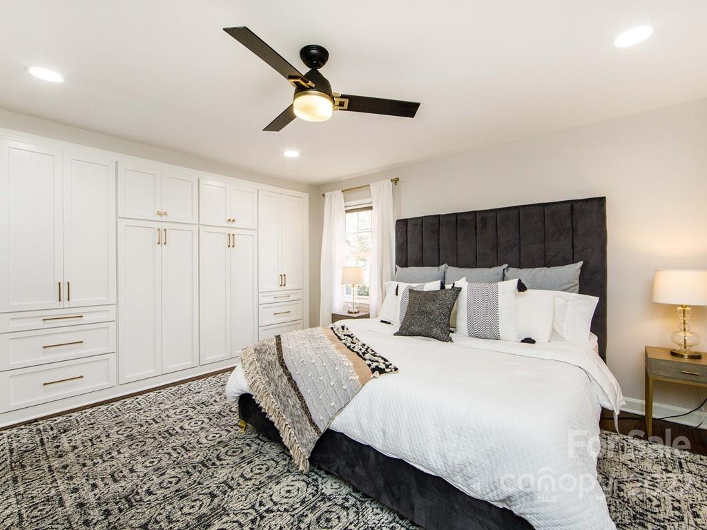 1000 Braeburn Road Charlotte, NC 28211 - Photo 29 of 48 a bed room with a bed and a ceiling fan