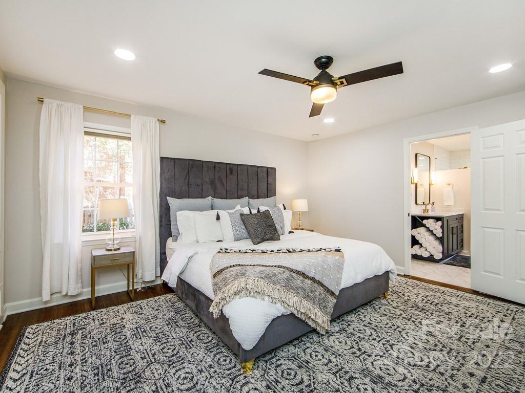 1000 Braeburn Road Charlotte, NC 28211 - Photo 30 of 48 a bedroom with a bed and a dresser
