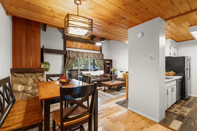 a dining room with furniture and a window