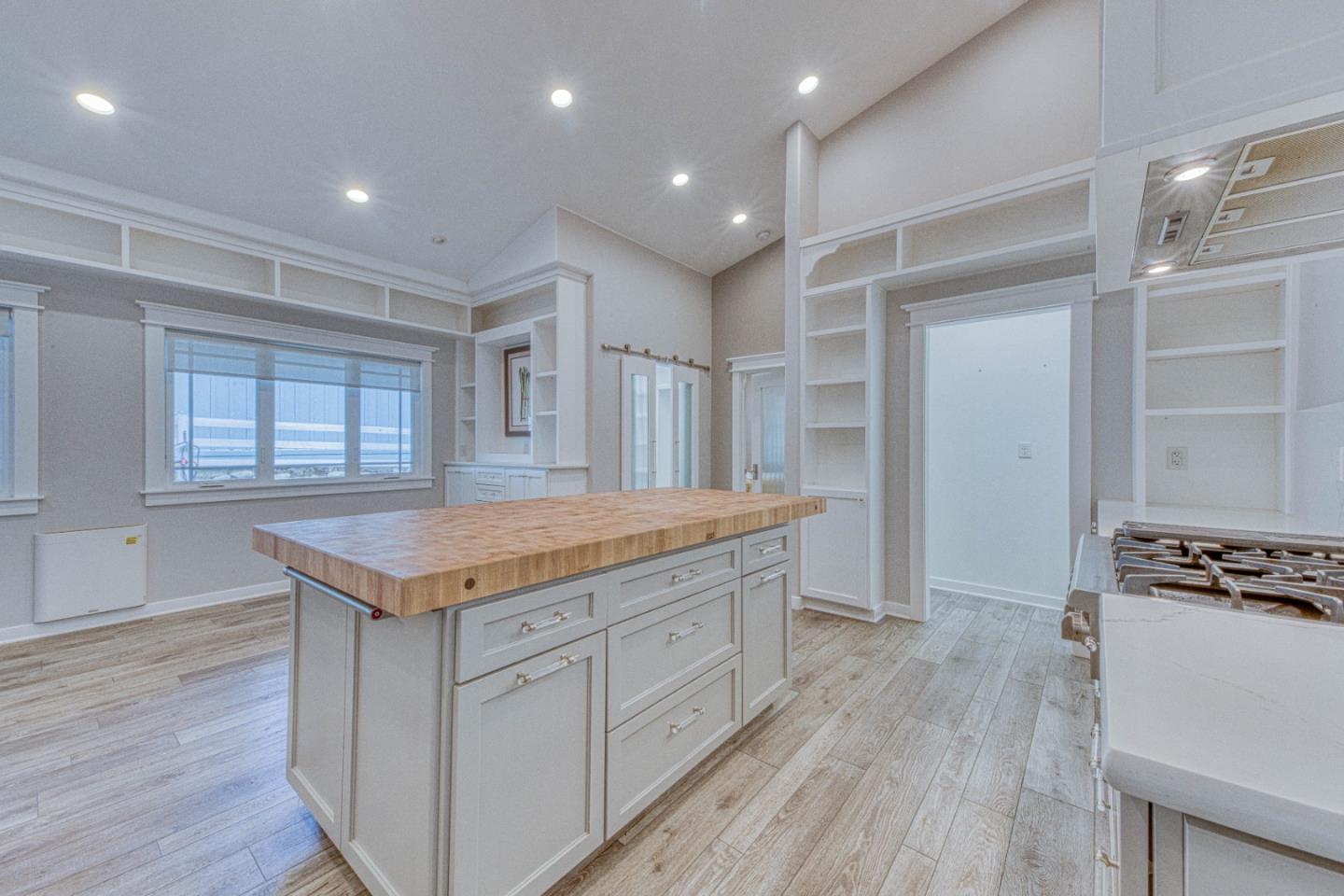 47317 Arroyo Seco Road Greenfield, CA 93927 - Photo 8 of 47 a kitchen with granite countertop a stove and a wooden floors