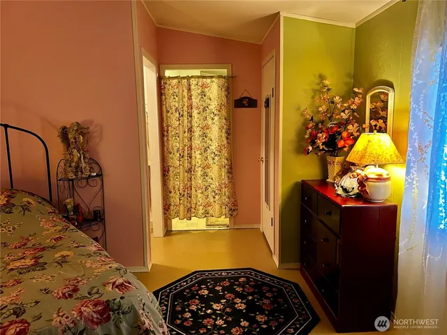 a bedroom with a bed and a dresser