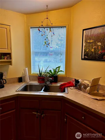 a kitchen with a sink and cabinets