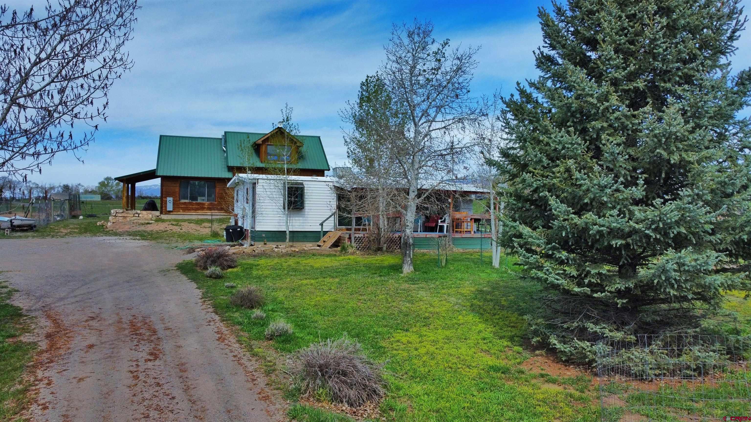 17081 2550th Road Cedaredge, CO 81413 - Photo 2 of 21 a front view of house with yard and green space