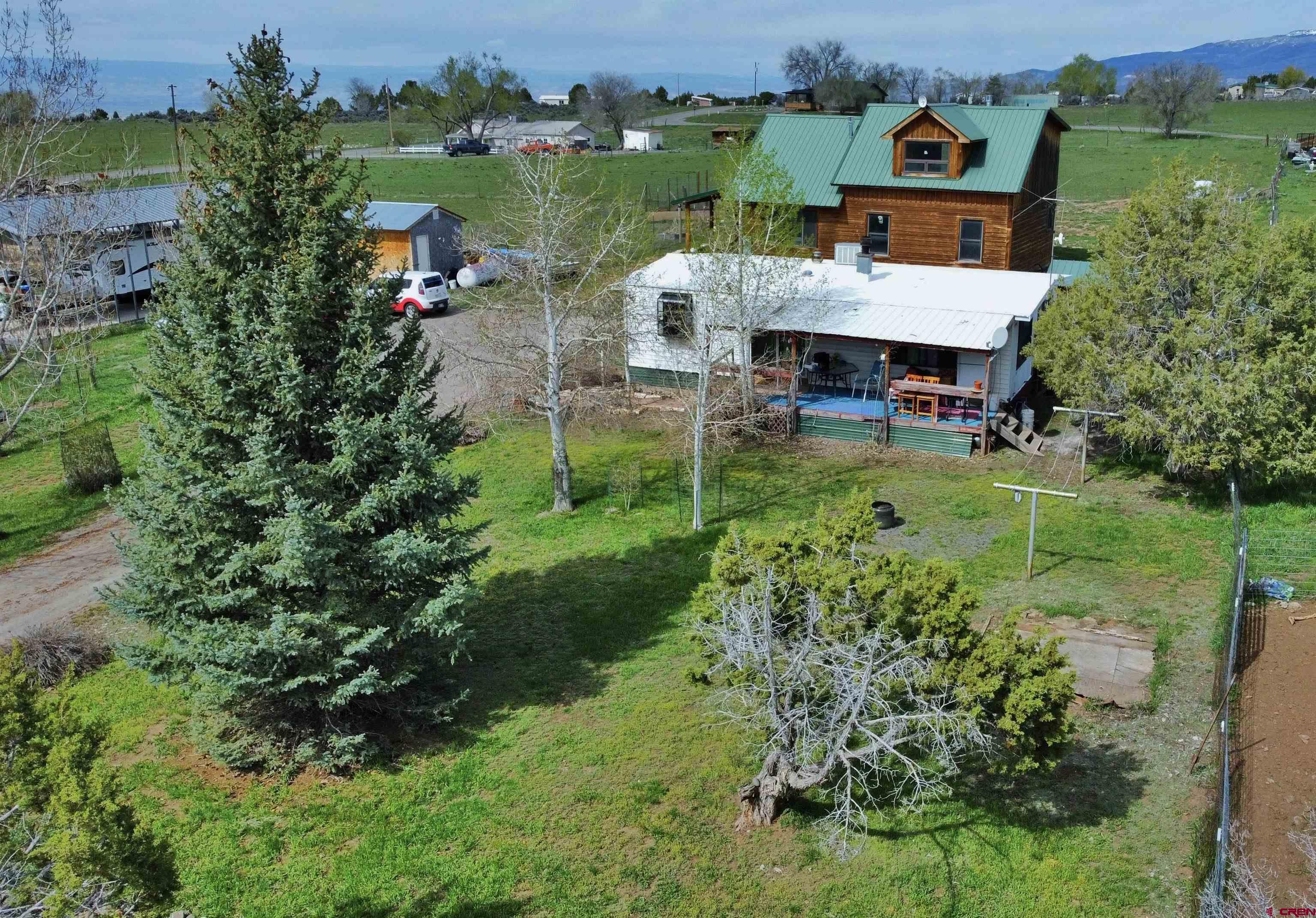 17081 2550th Road Cedaredge, CO 81413 - Photo 21 of 21 an aerial view of a house with a garden
