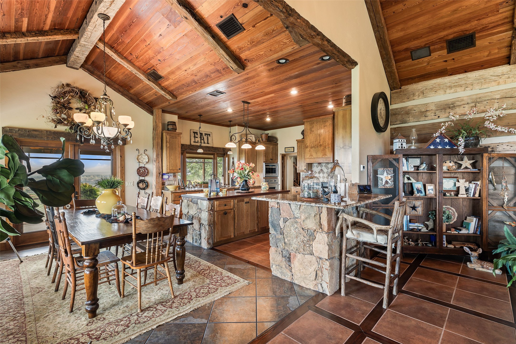 8400 Ranch Road 1431 Marble Falls, TX 78654 - Photo 14 of 30 A spacious, open-concept living area with soaring wood ceilings and rustic stone accents.